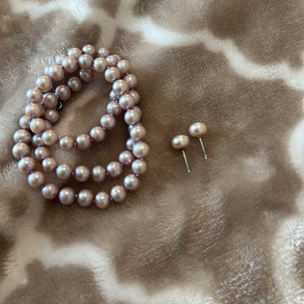 Pink pearls set with earrings.